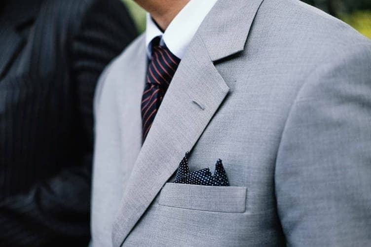 Flat fold pocket square in a suit jacket breast pocket